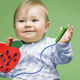 This wooden apple has a thread and a worm-shaped needle attached, letting kids work on their hand-eye coordination while they create (and un-create) fun lacing patterns.